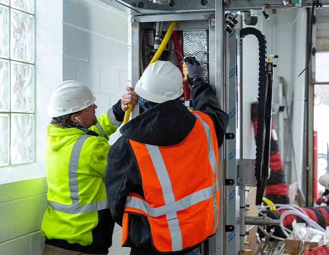 technicians installing automatic car wash