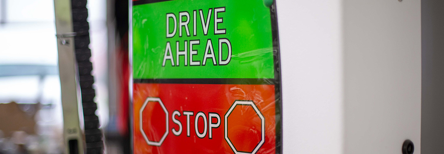 drive ahead / stop sign in automatic car wash
