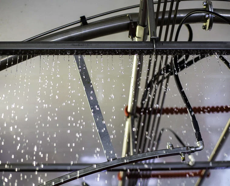 Automatic car wash spaying clear liquid