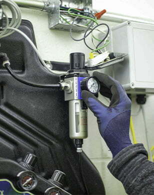 Technician checking equipment reading