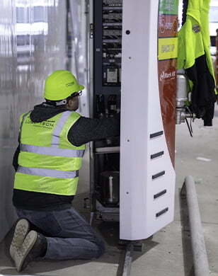 Technician servicing equipment