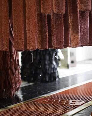 Red wash cloth on car wash equipment