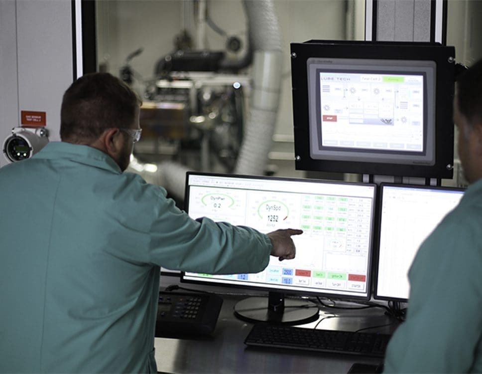 Technician pointing at a screen with a lot data