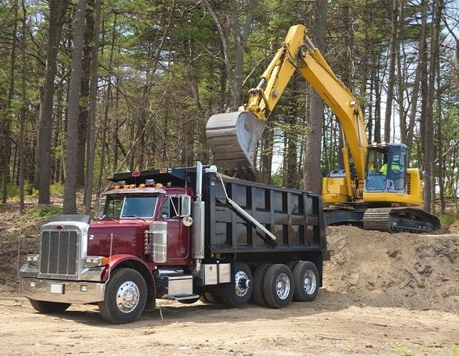Excavator loading truck