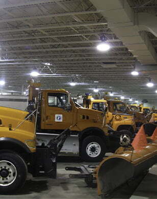 Yellow trucks parked in a row