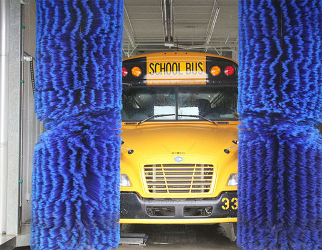 School bus driving through a wash