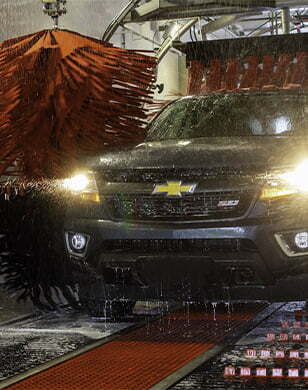 Chevy SUV going through car wash