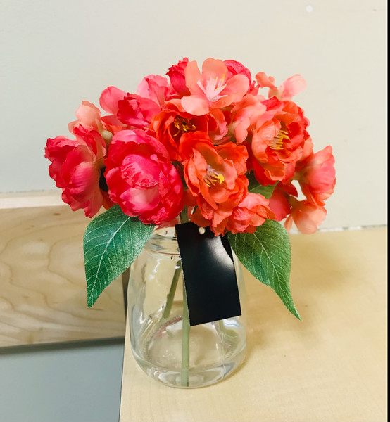 Dark Pink Cherry Bloosoms in a Glass Container