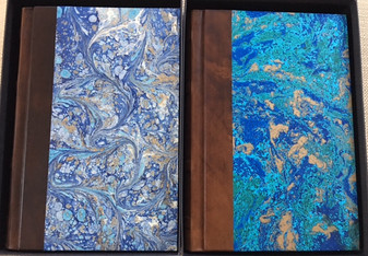 Blue Marbled - left & Green Marbled - right 
with Almalfi handmade, deckled-edge pages 
Smythe-sewn, Leather binding