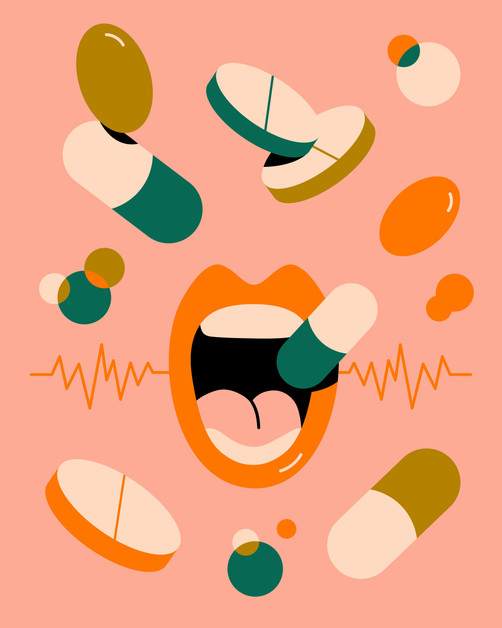 5-HTP Serotonin and Mood Close up of person taking brightly coloured vitamins.