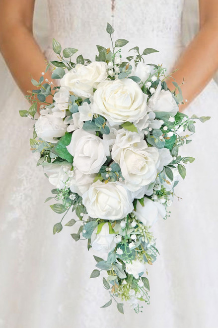 White cascading bridal bouquet with lily of the valley, roses & hydrangea designed by The Brides Bouquet.