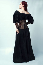 Back view of gold brocade corset with adjustable lace-up fastening and modesty panel