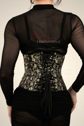 Back lace-up detail of black and gold corset