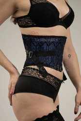 Side view of the fan-laced waist belt trainer, highlighting the 7-inch "waspie" depth that provides focused waist cinching without restricting the hips or ribs.