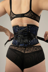 Rear view of the 1827 corset showcasing the unique fan lacing system, allowing for quick and easy one-handed tightening to achieve significant waist reduction.