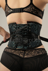 Detailed view of the 1827 corset showcasing the unique fan lacing system, allowing for quick and easy one-handed tightening to achieve significant waist reduction.