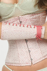 Close-up of the matching pink leather arm gloves (gauntlets) included with the underbust corset set, showcasing the lace-up detailing and tailored fit.