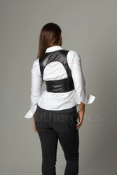 Rear view of a fitted leather top showing the vertical tailored seams and a full-length discreet back zipper for a secure fit.