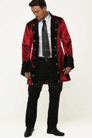Man wearing a red velvet gothic tailcoat with black accents and silver buttons, styled with a white shirt, tie, and black trousers.Red Velvet Gothic Tailcoat for Men – Vintage Steampunk Jacket