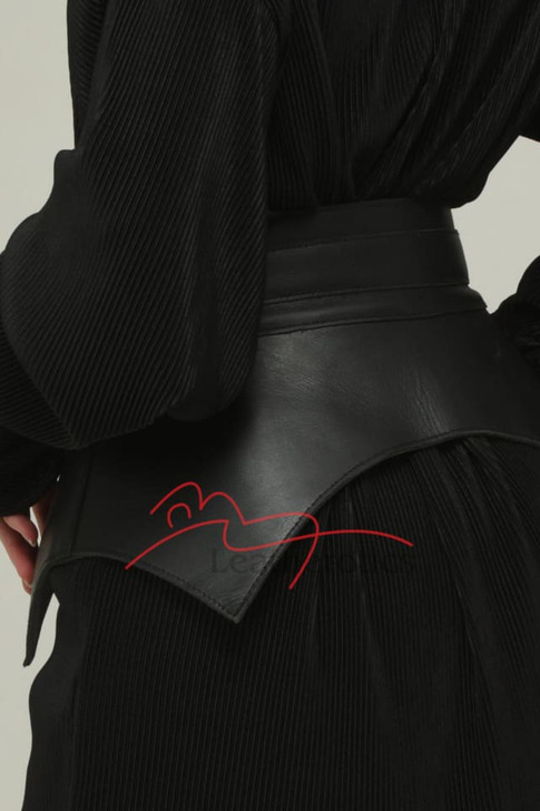 Adjustable black leather waist belt styled over a dress