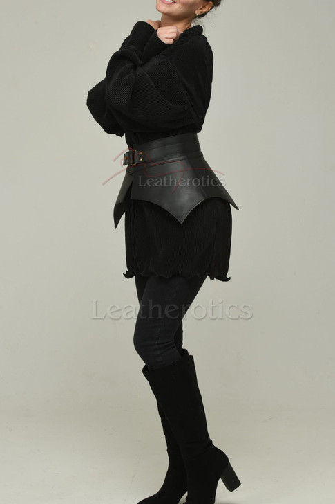 Side profile of wide leather waist belt creating a cinched silhouette