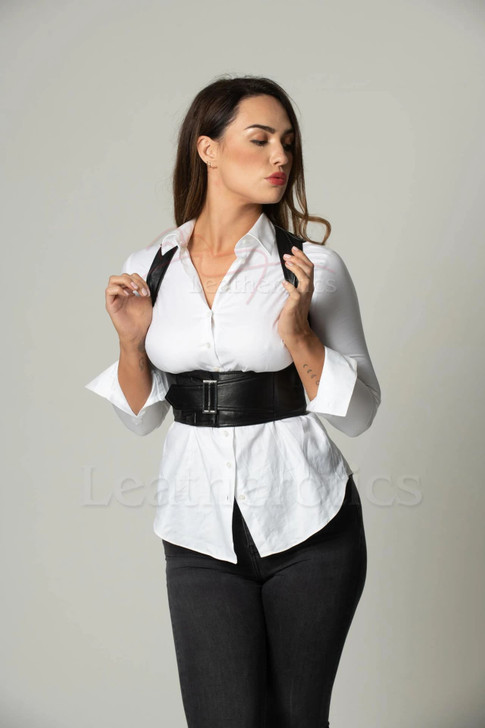 Model wearing a black leather top with built-in waist support, styled for a modern alternative or gothic aesthetic.