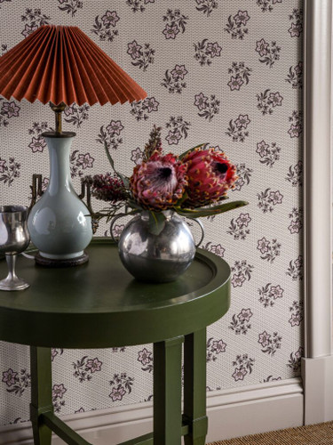 Entry way with small print floral wallpaper.