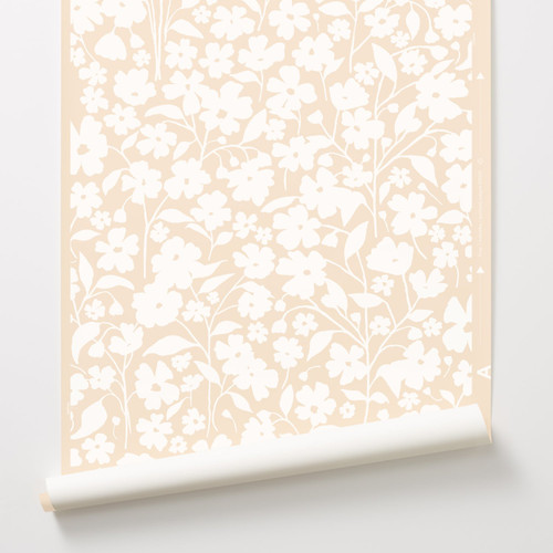 A subtle floral wallpaper in white on blush.