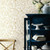 Kitchen featuring gold and white floral wallpaper with birds.