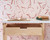 Office with pink abstract wallpaper.