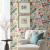 Bright floral wallpaper in a sitting room.