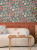 Bright and fun floral wallpaper in pink, red, blue and green.