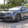 Front three-quarter view of a silver 2022 Subaru WRX with Revel 1TR3CDSU007 coilovers and aggressive stance