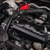 IAG black aluminum alternator cover with white hex accent plate on 2022-2026 Subaru WRX
