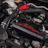 IAG black aluminum alternator cover with red hex accent plate on 2022-2026 Subaru WRX