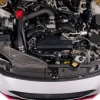 Top down view of IAG black aluminum alternator cover with black hex accent plate on 2022-2026 Subaru WRX