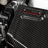 Close up of COBB Redline Gloss Carbon Fiber Fuse Cover 846665-Driver installed in 2022-2026 Subaru WRX engine bay