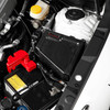 COBB Redline Gloss Carbon Fiber Fuse Cover 846665-Driver installed in 2022-2026 Subaru WRX engine bay
