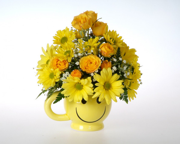 Your recipient will be all smiles when they receive this keepsake mug with fresh flowers