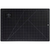 black side of 12" x 18" alvin professional self-healing cutting mat with white grid lines and measurements