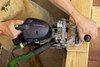 Man using  Festool DOMINO XL joiner on wood piece