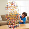 child playing with KNEX 3-In-1 Amusement Park Set pieces in a ferris wheel formation