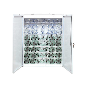 white enameled steel cabinet with two open doors showing 10 fog-free safety goggles and 36 safety glasses white enameled steel cabinet with two open doors showing 10 fog-free safety goggles and 36 safety glasses