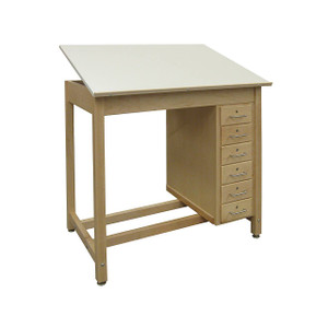 light brown drawing table with tilting top and pencil ledge, and six small drawers under the right side