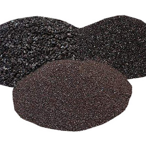 three piles of brown aluminum oxide sand blasting abrasive media in coarse, medium, and fine grits