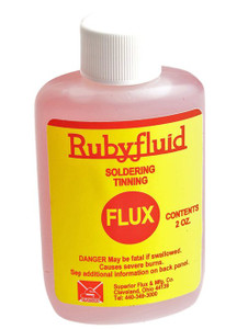 plastic bottle of thin pink soldering and tinning flux that has yellow label with red text and white cap plastic bottle of thin pink soldering and tinning flux that has yellow label with red text and white cap