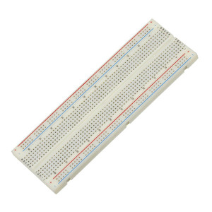 white rectangular board with many tiny holes and red and blue lines along the length of each side white rectangular board with many tiny holes and red and blue lines along the length of each side