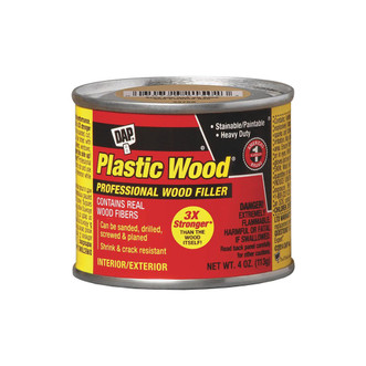 red 4 ounce metal can of Dap Plastic Wood Solvent-based Professional Wood Filler in walnut color