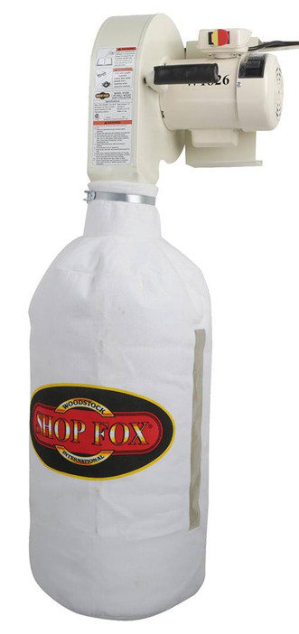 white wall-mounted woodworking dust collector with white Shop Fox dust collection bag attached