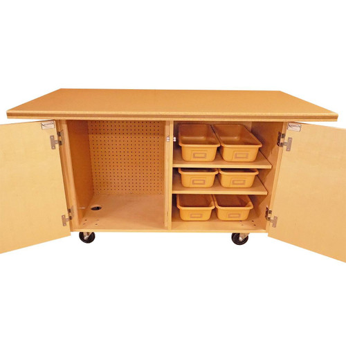 wooden work bench has 1-1/4" thick table top with two open cabinets to reveal six plastic organizational trays